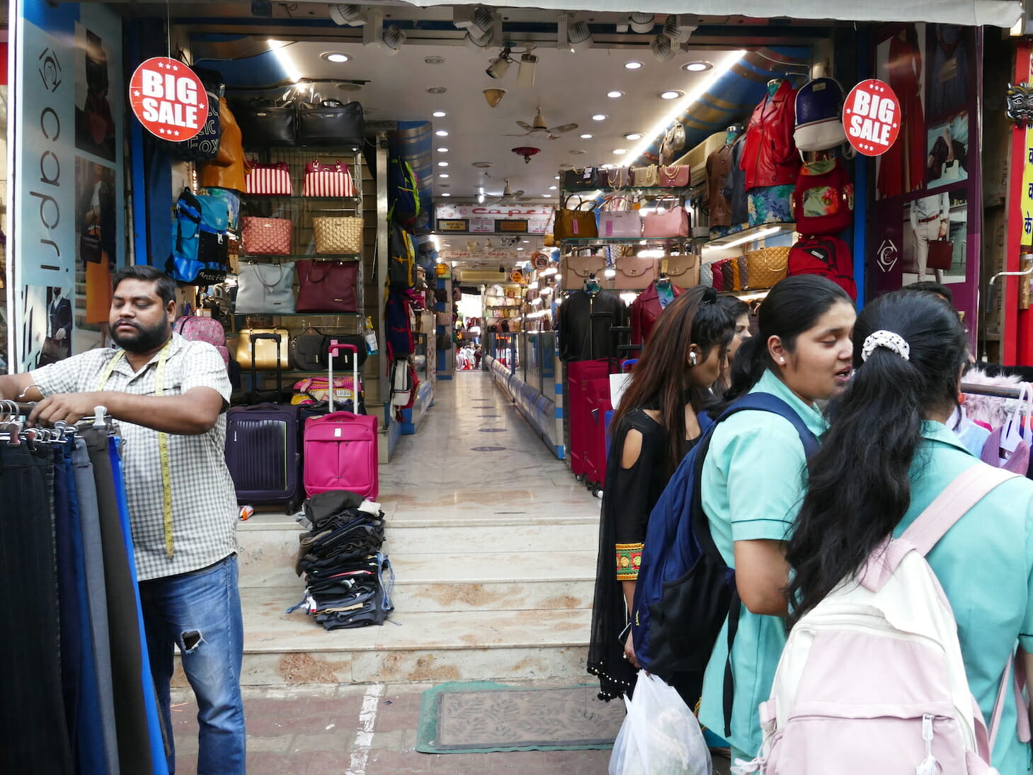 Rent paying shop owners vs free squatting street vendors: A never ...