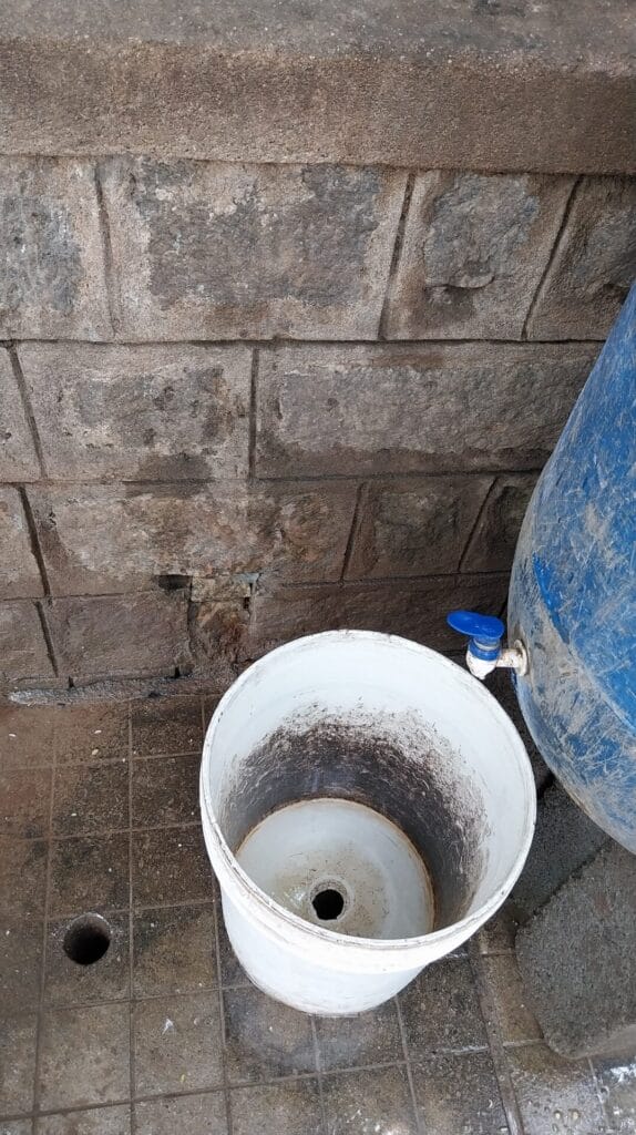 Drum with a bucket to collect water