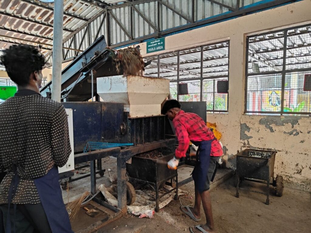 The shredded waste is collected in a trolley and taken to the windrow composting site.