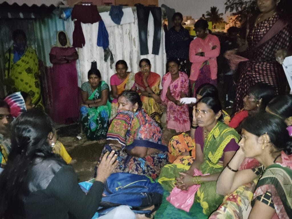 slum residents in a meeting