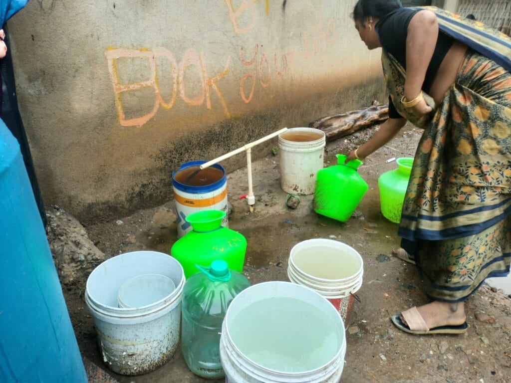 woman filling bucket