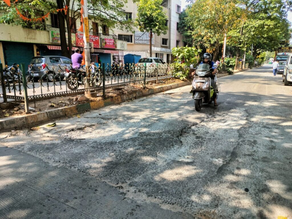 pothole on white-topped roads