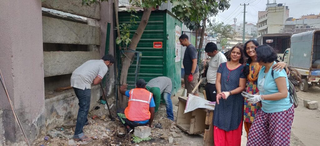 Citizens helping to attach tree guards to protect trees. 