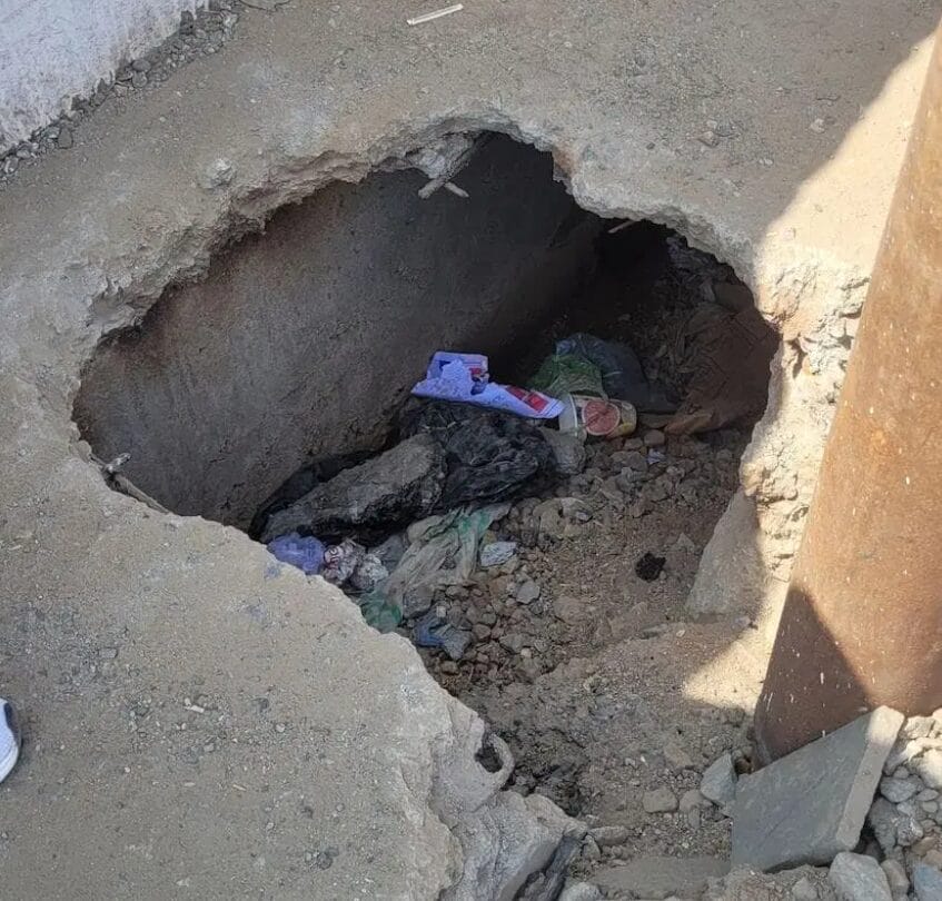 A trench in a narrow footpath