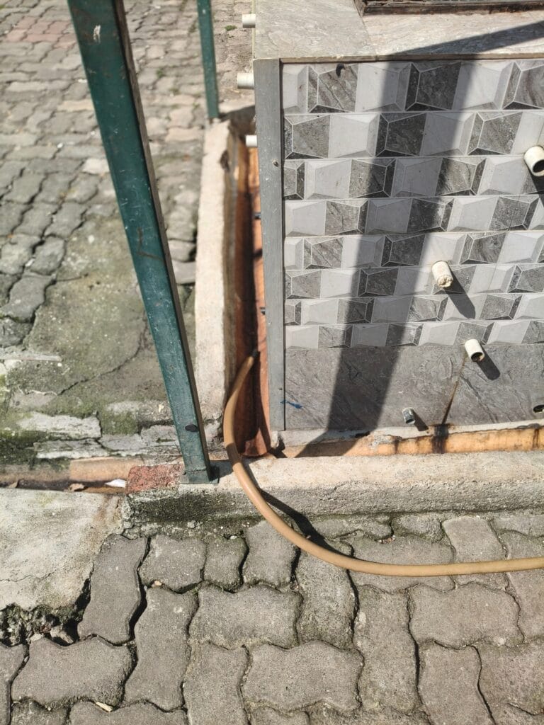 Gutters for leachate from compost pits