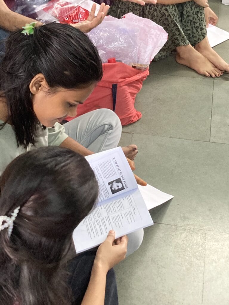 Women reading a book on the Constitution
