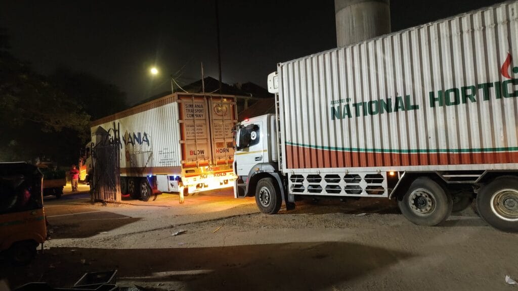 Lorries in Koyambedu at night