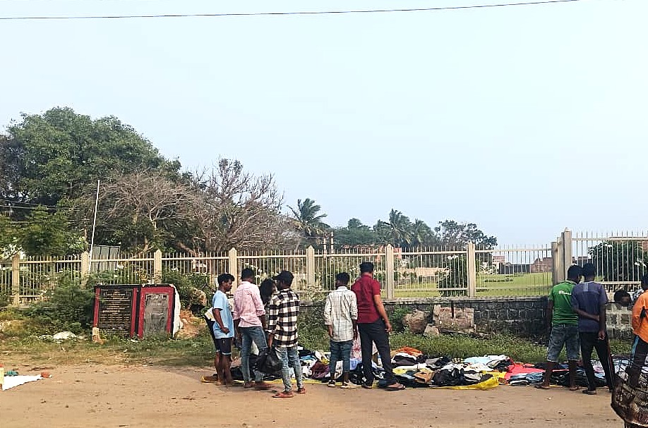 MAPS workers shopping for clothes at a roadside thrift shop.